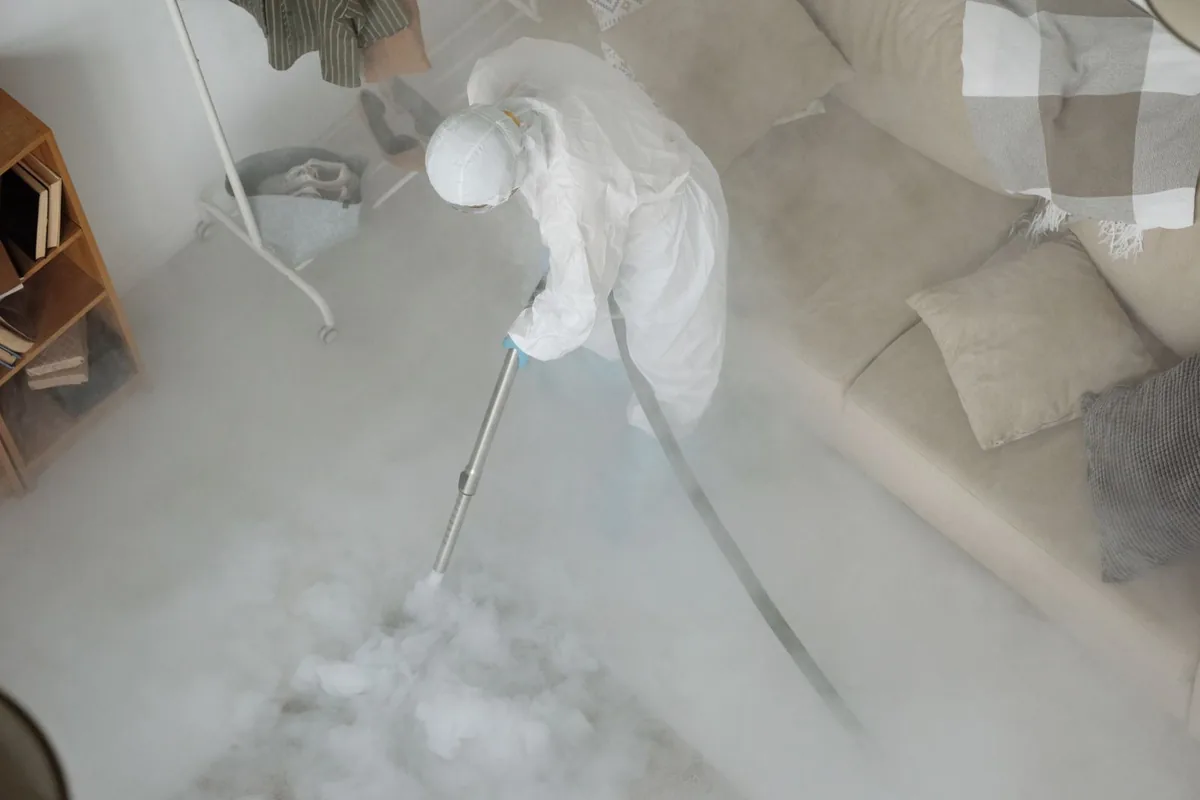 Biohazard cleanup technician in protective equipment, Fox Creek, Detroit, MI